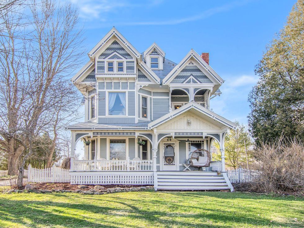 Victorian home for sale with blue exterior.