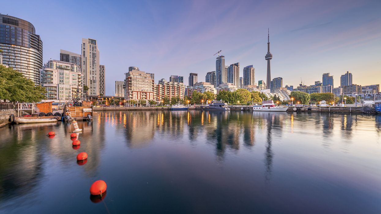 view of toronto skyline and cn tower from lake ontario