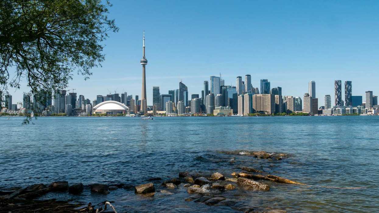 view of toronto skyline and lake ontario from toronto island