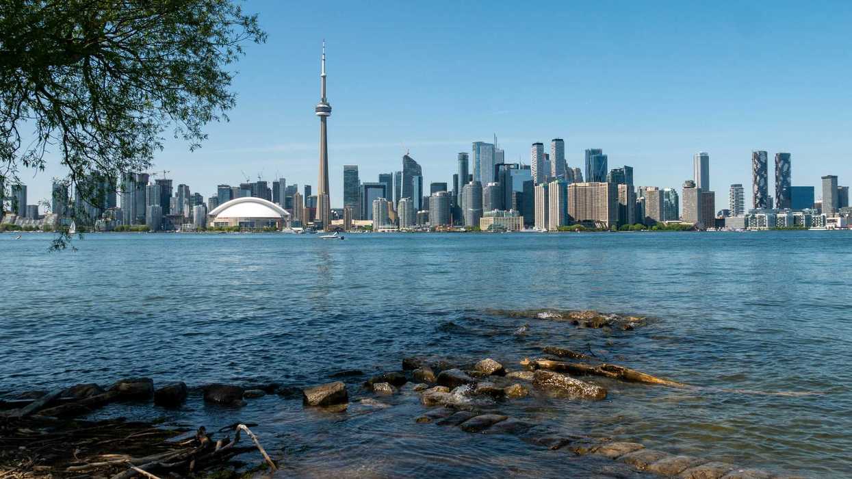 view of toronto skyline and lake ontario from toronto island