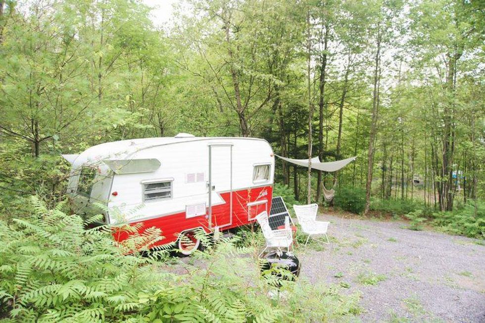 Vintage red camper in Ontario camp motel, This Ontario Campground Motel Is Off The Grid & Has Serious Woodstock Vibes