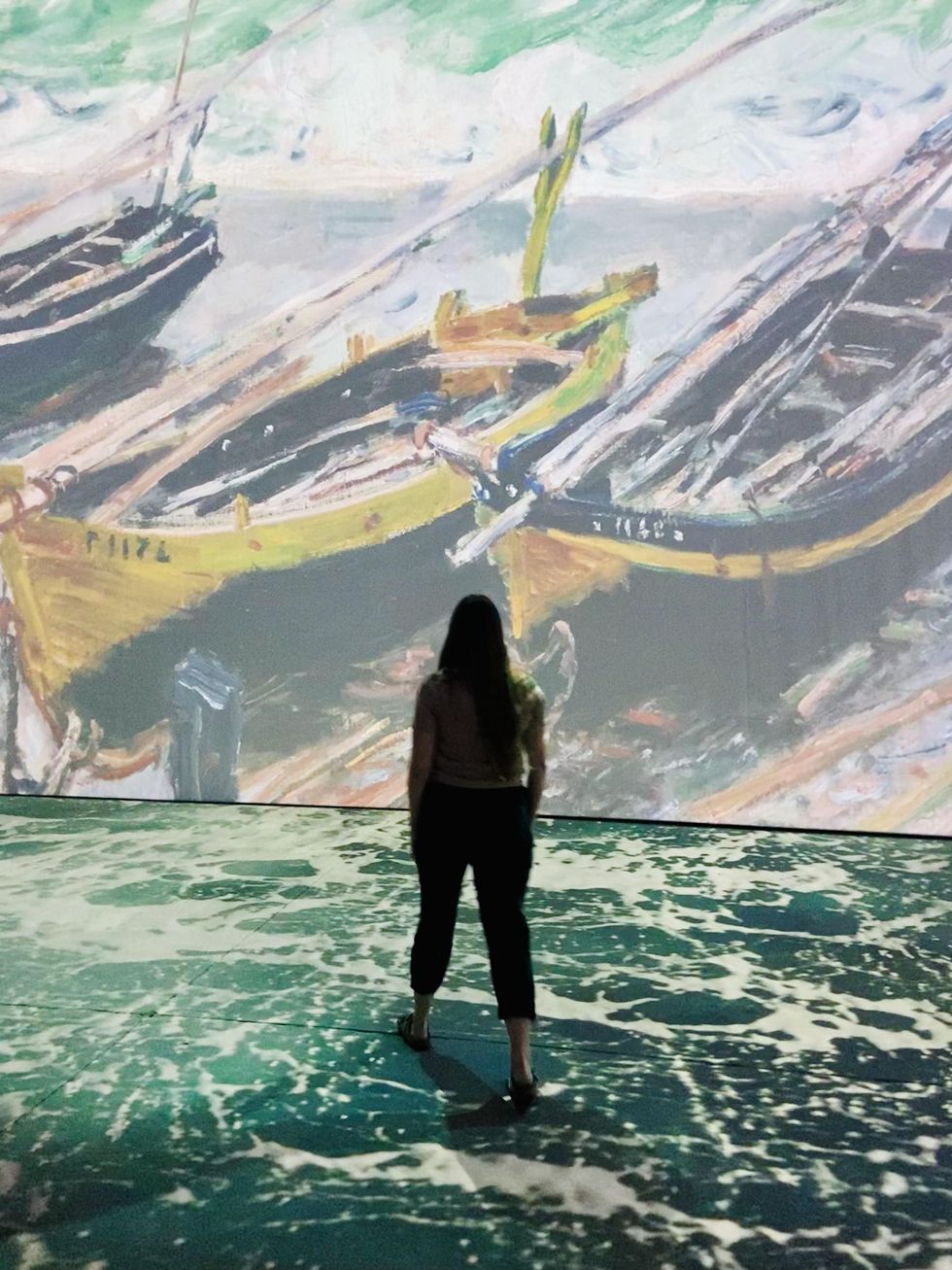 Walking through immersive Monet art exhibit in Ottawa.