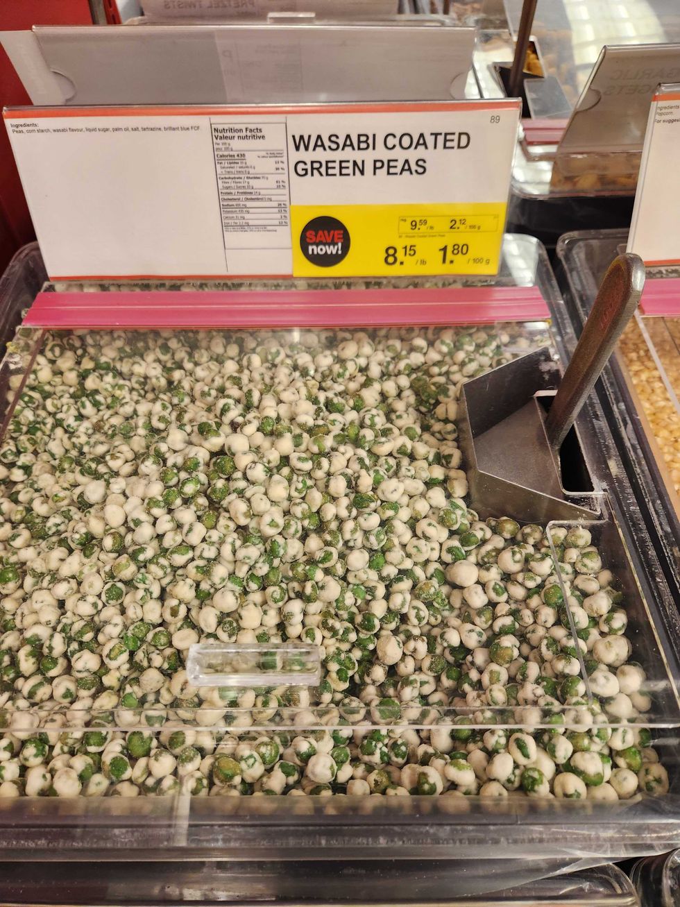 Wasabi coated green peas at Bulk Barn on sale for $1.80 per 100 grams.