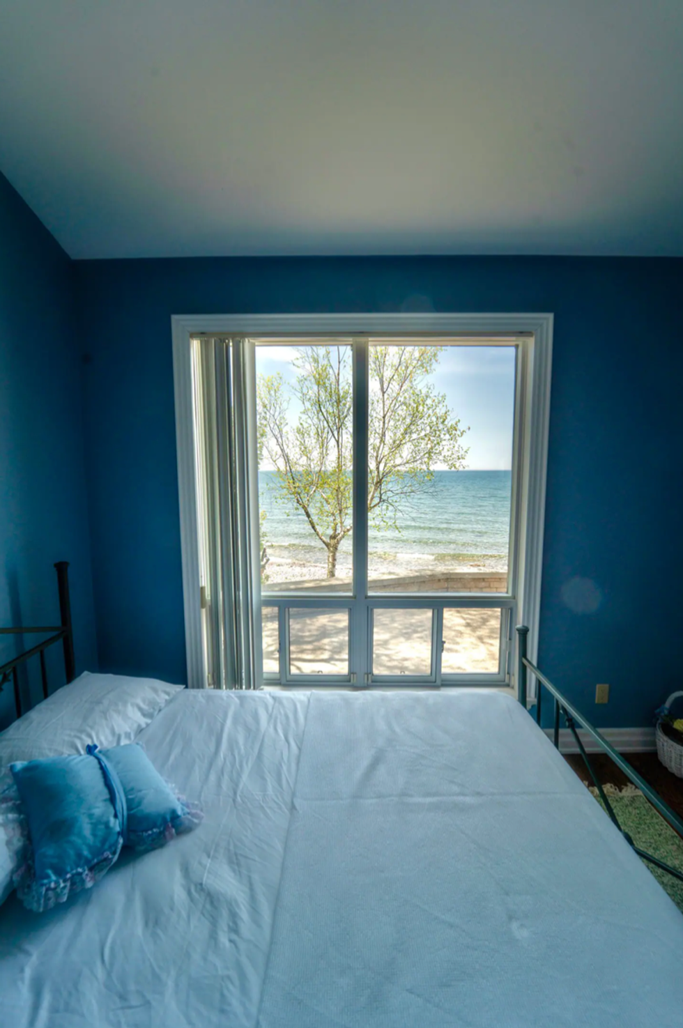 Water views from a bedroom.