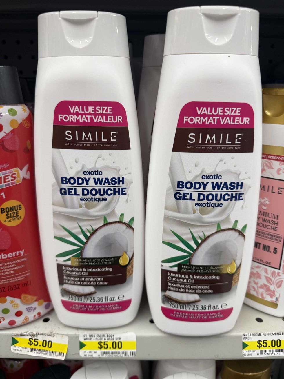 White and brown bottles on a store shelf that have a coconut on them and a label that reads Exotic Body Wash.