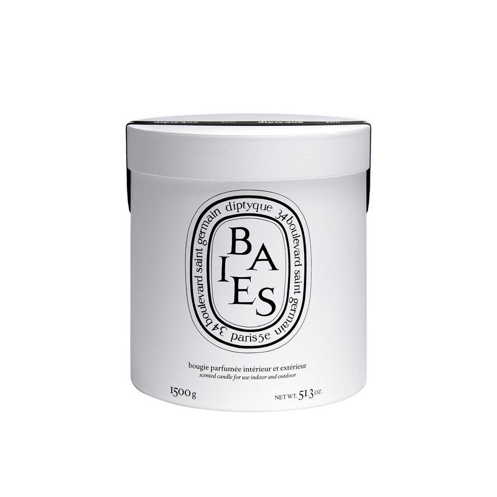 White Diptyque Baies scented candle.