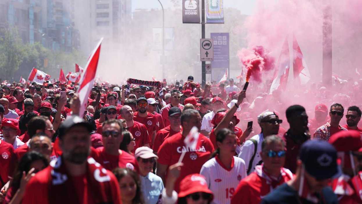 Why do soccer fans love smoke bombs?