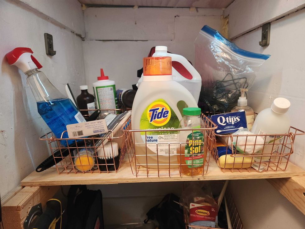 Wire baskets in a closet.
