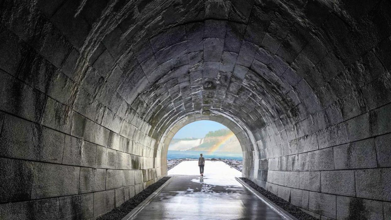 Woman standing at the end of The Tunnel in Niagara Falls.