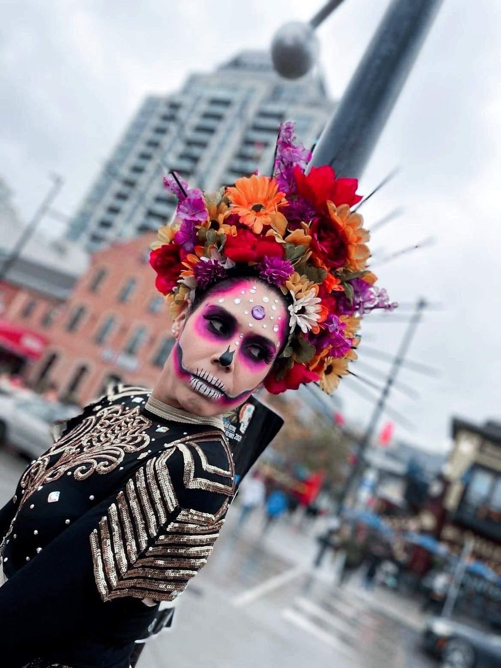 Woman with skeleton face paint for Day of the Dead.