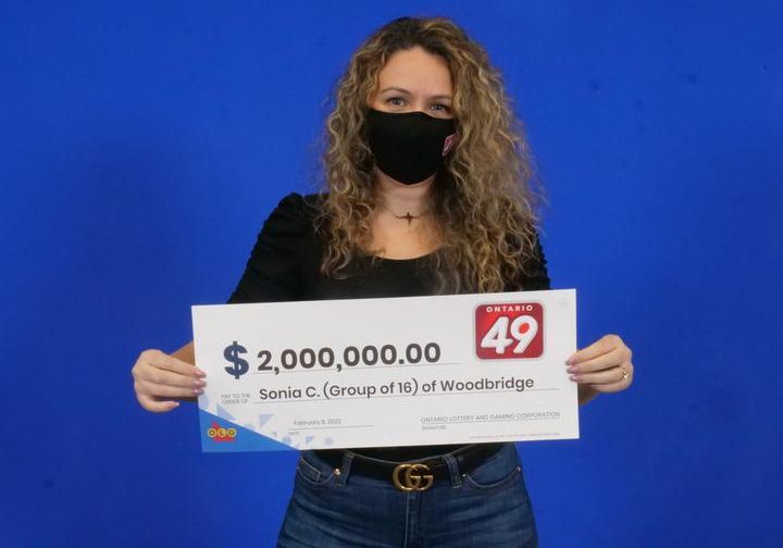 Woodbridge resident Sonia Correia-Batista picking up her portion of the winnings.