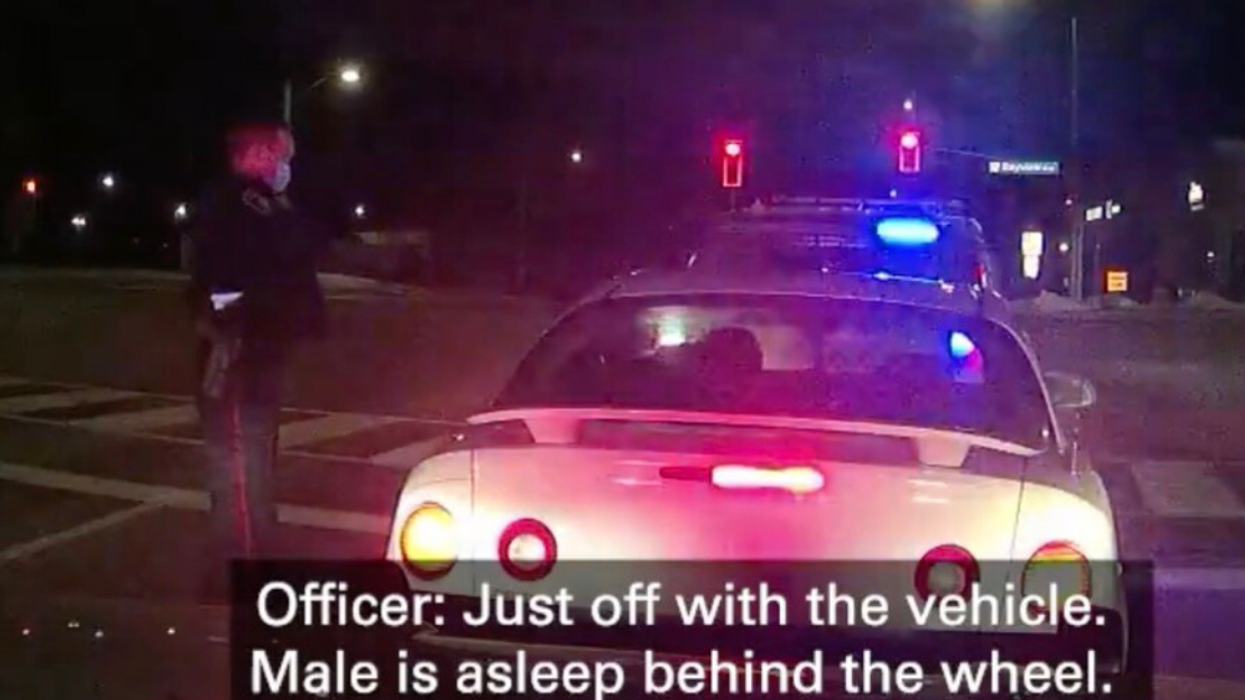 York Regional Police approach driver asleep at the wheel.